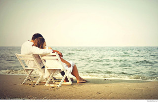 Couple sitting beach ocean looking - a couple sitting free wallpaper