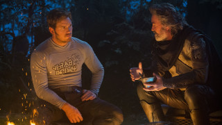 Campfire men drinks cellphone sitting - one holding free wallpaper