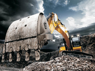 Bulldozer digging rocks cloudy sky - carl hoppe free wallpaper for desktop