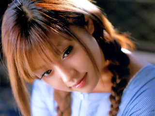 Young woman braid smiling camera - a young woman free wallpaper