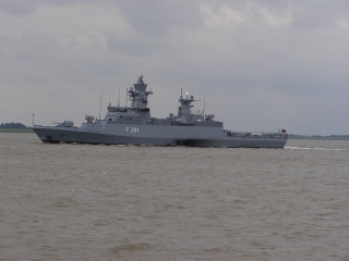 Battleship shoreline boat cloudy sky - a boat free wallpaper