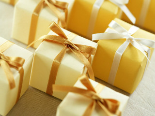Wrapped presents with ribbons and - the top of them free wallpaper