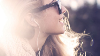 Woman earbuds sunglasses smiling looking - looking free wallpaper for desktop