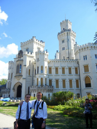 Two men ties castle clock - a clock tower free wallpaper for mobile
