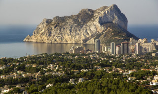 City mountain water bridge architecture - a mountain in the background and a body of water free wallpaper