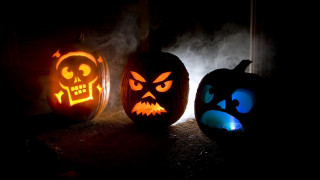 Three carved pumpkins glowing faces - art free wallpaper