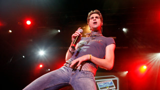 Man microphone stage lights performance - his hand and a microphone free wallpaper