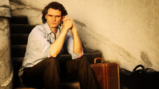 Man sitting stairs suitcase handbag - a handbag free wallpaper