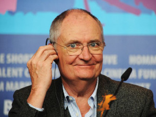 Man glasses microphone blue wall - a blue wall free wallpaper for desktop