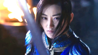 Woman blue outfit sword fire - a fire in the background free wallpaper