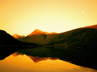 Mountain lake yellow sky sunset - a sun setting free wallpaper