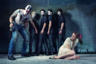 Woman sitting ground group people - a man in the background free wallpaper