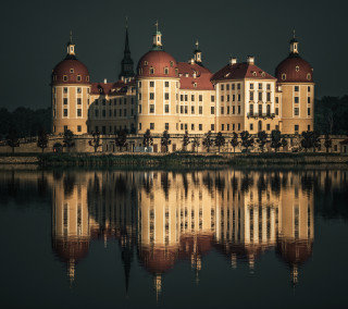 Large building red roof clock - a body of water free wallpaper for tablet