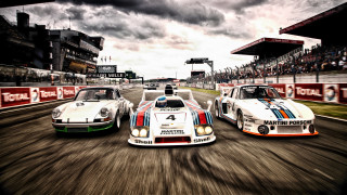 Race cars track cloudy sky 2 - vintage free wallpaper