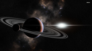 Saturn like object bright light - a distant star in the foreground free wallpaper