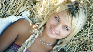 Blond woman hay pile smile - blond free wallpaper