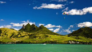 Kite flying water mountains boat - the background and a boat free wallpaper for desktop