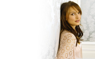 Woman leaning wall smiling looking - dorothy coke free wallpaper