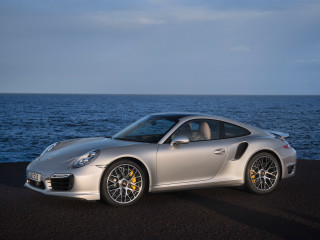 Silver sports car ocean road 2 - a sky background and a body of water free wallpaper