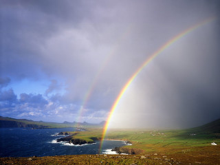 Rainbow sky water grassy hill - a grassy hill free wallpaper