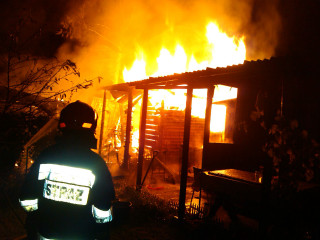 Firefighter burning house night yellow - the roof free wallpaper