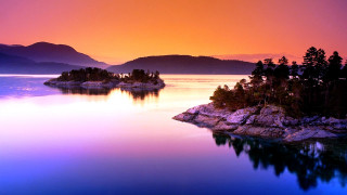 Sunset lake island mountains beautiful - a small island in the middle of it free wallpaper