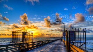 Pier fence sunset ocean cityscape - a pier free wallpaper for desktop