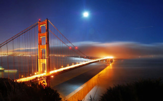 Long bridge night full moon - a full moon in the sky above free wallpaper