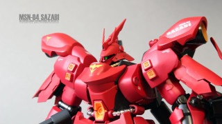 Red robot yellow black arms - gray background free wallpaper