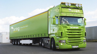 Green semi truck parking lot - a parking lot next free wallpaper