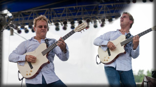 Two men playing guitars stage - eric peterson free wallpaper