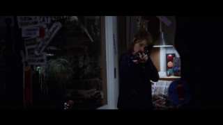 Woman holding camera dark room - the wall behind her free wallpaper for desktop