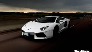 White sports car cloudy sky 3 - a dark sky above free wallpaper