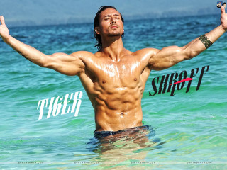 Man standing ocean arms outstretched - his hands in free wallpaper