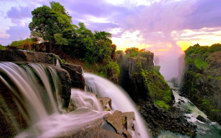 Waterfall sunset cascade cloudy sky - a cloudy sky free wallpaper for desktop