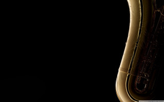 Saxophone closeup black background light - a light reflection free wallpaper for desktop