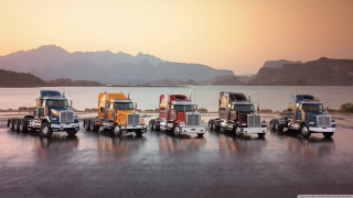 Semi trucks lake mountains parking - 4k uhd image free wallpaper