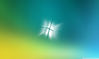 Blurry cross blue green yellow - a white cross free wallpaper