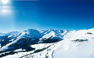 Skiing snowy mountain sun blue - a snowy mountain top free wallpaper