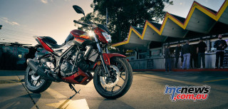 Red motorcycle night promotional vehicle - the side of a road next free wallpaper