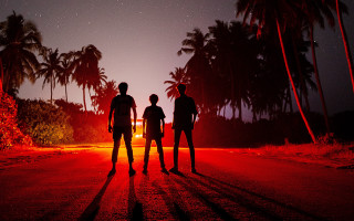 Night road palm trees fireworks - three person free wallpaper for desktop