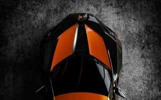 Motorcycle black orange stripe closeup - a close up of a motorcycle free wallpaper