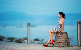 Woman sitting post water boats - araceli gilbert free wallpaper