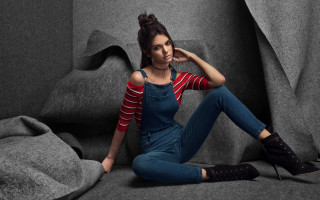 Woman sitting couch striped jeans - striped free wallpaper