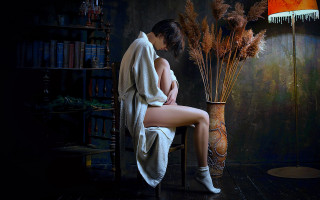Woman sitting vase dried grass - a chair next free wallpaper