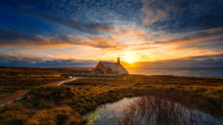 House hill sunset water matte - a sunset in the background and a body of water free wallpaper