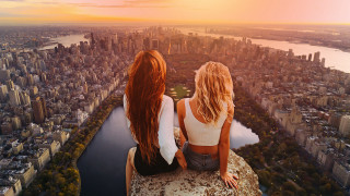 Cityscape sunset two women riverside - daren bader free wallpaper for desktop