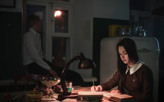 Woman sitting desk book lamp - a pen free wallpaper