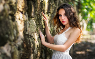 Woman white dress leaning wall 11 - against free wallpaper for desktop