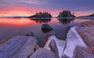 Sunset lake rocks trees pink 2 - a beautiful sunset over a lake free wallpaper